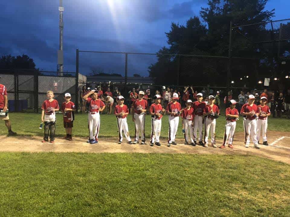 a group of baseball players posing for a photo