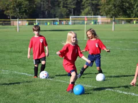kids playing football on a field