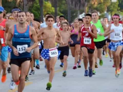 a group of people running on a road