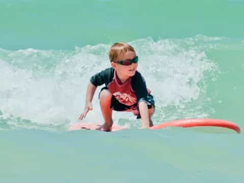 a boy riding a surfboard