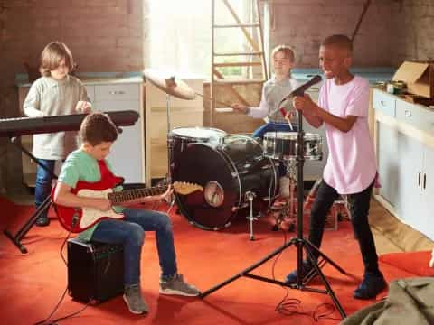 a group of kids playing instruments