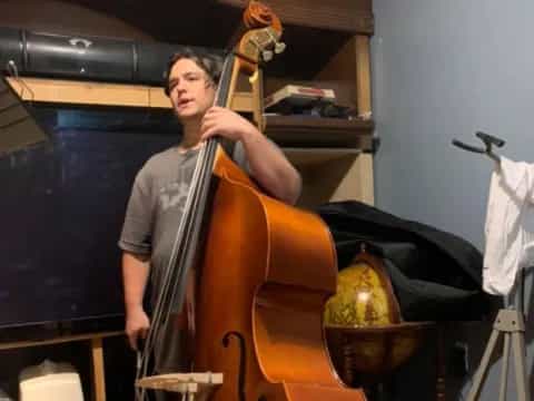 a person playing a cello