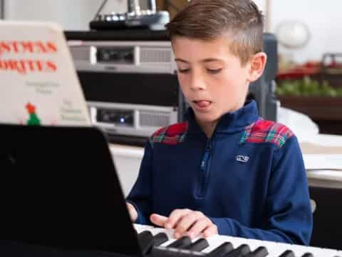 a young boy using a laptop