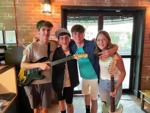 a group of people holding guitars