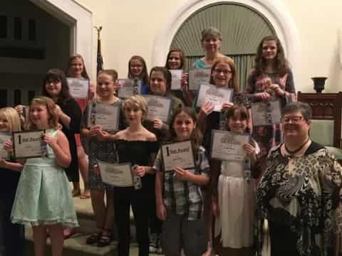 a group of people holding signs
