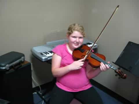 a person playing a violin