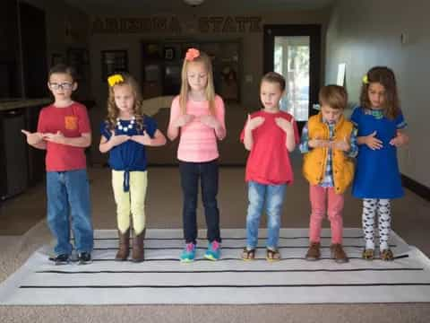 a group of children posing for a photo