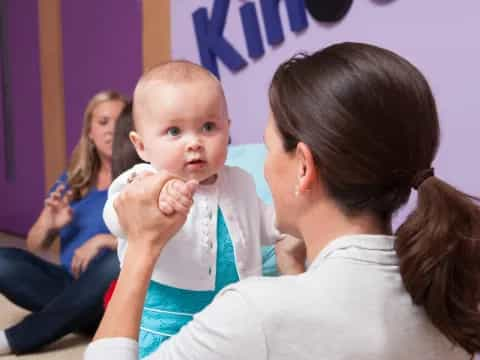 a person holding a baby