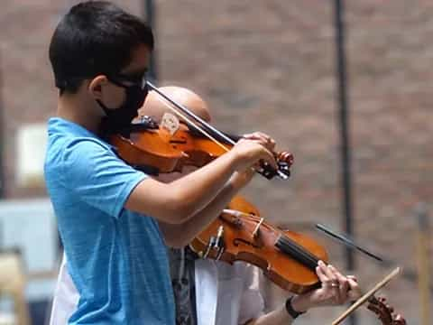 a person playing a violin