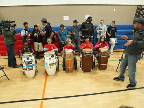 a group of people playing drums