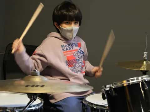 a boy playing drums