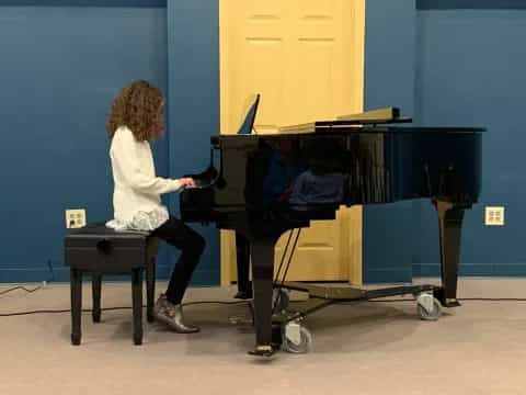 a person playing a piano