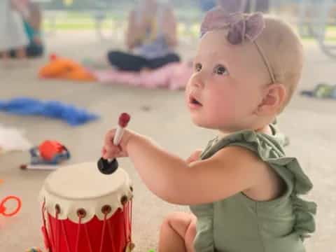 a baby playing with a toy