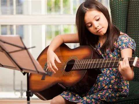 a person playing a guitar