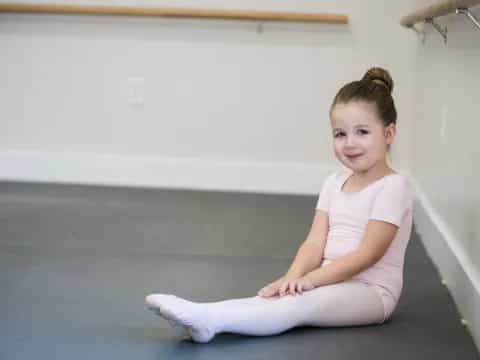 a girl sitting on the floor