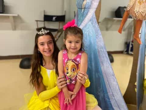 a group of women in dresses