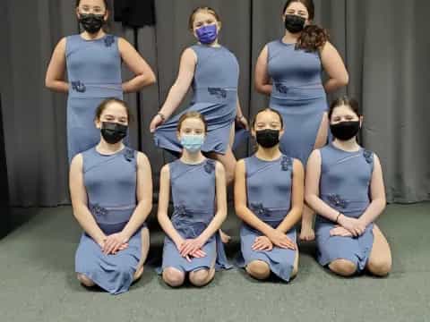 a group of people wearing masks