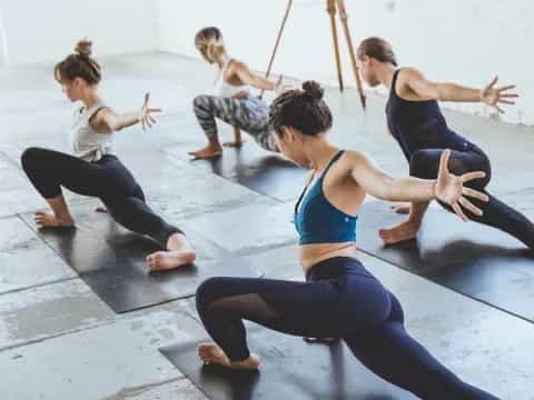 a group of people doing yoga
