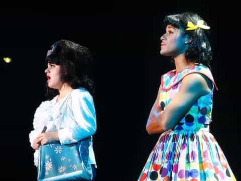 a couple of women in dresses