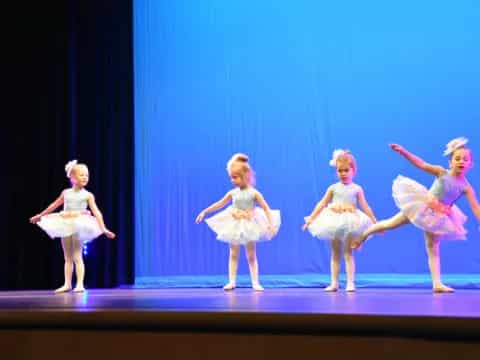 a group of girls on a stage