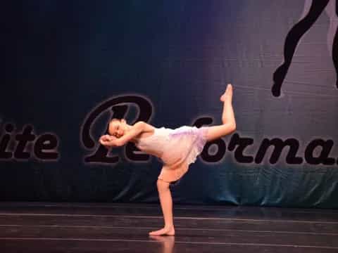 a woman dancing on a stage