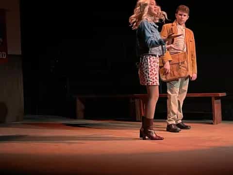 a man and woman on a stage