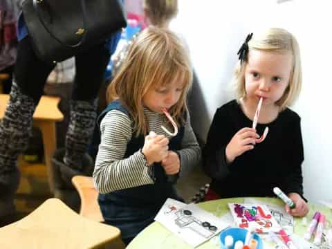 a couple of girls eating