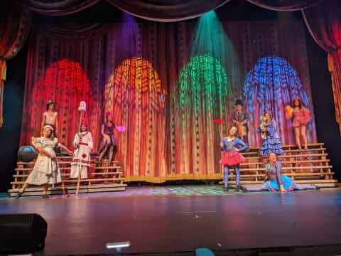 a group of children performing on a stage