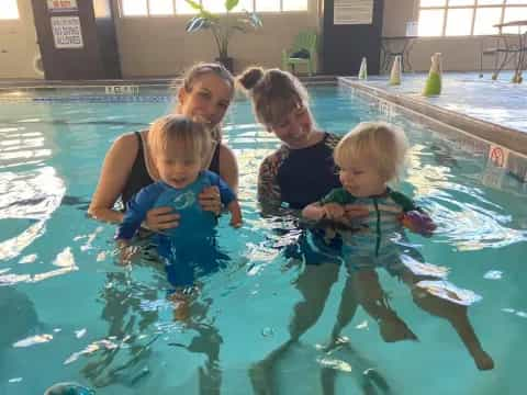 a group of kids in a pool