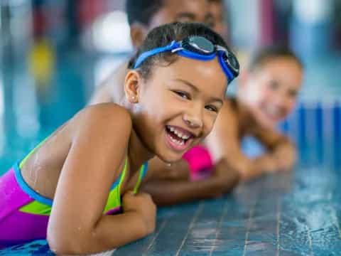 a young girl in a pool