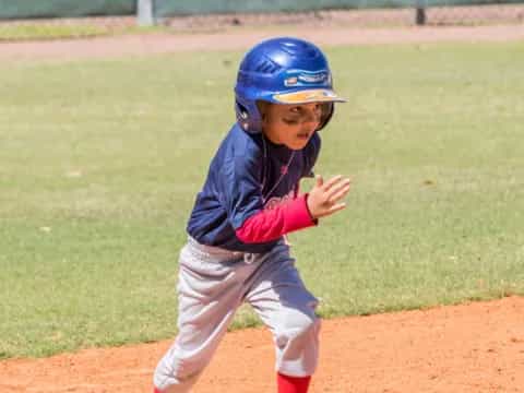 a young boy playing baseball
