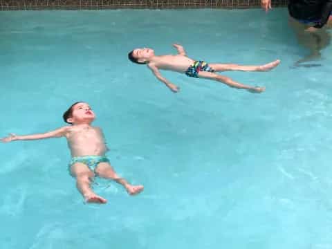 two boys in a pool