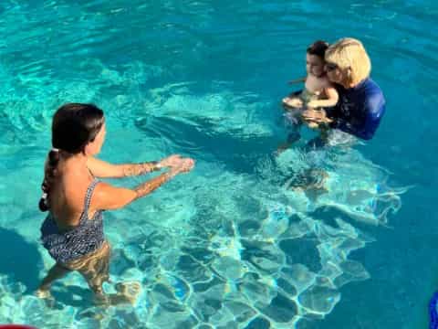 a group of people in a pool