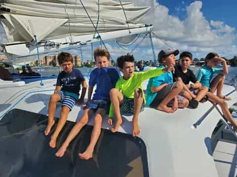 a group of boys on a boat