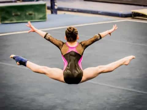 a woman doing a plank on a track