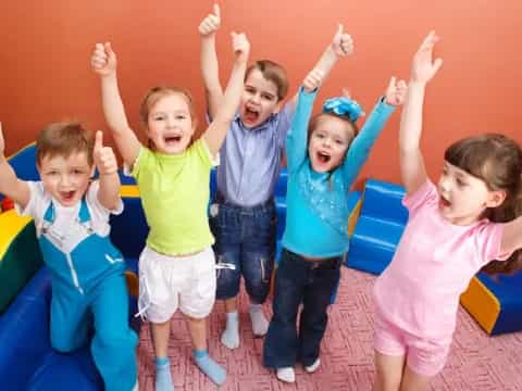 a group of children in a ball pit