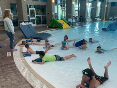 a group of people in a pool