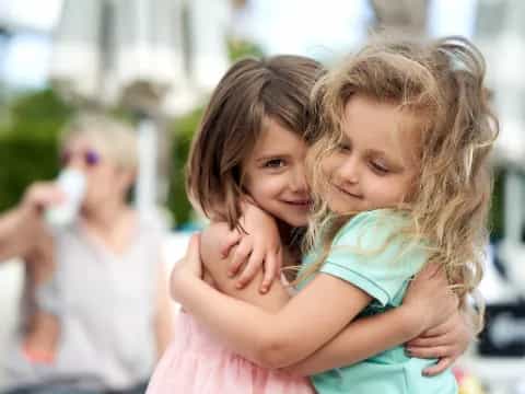 a person holding a child