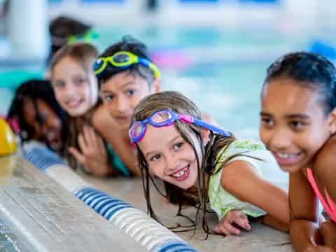 a group of children in a pool