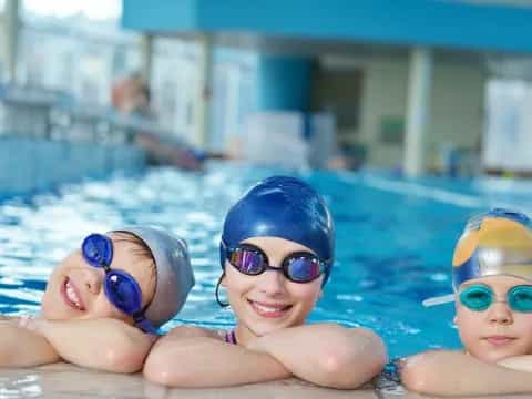 a group of kids in a pool