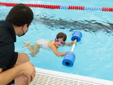 a man and a woman in a pool