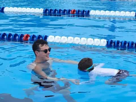 a man and a woman in a pool