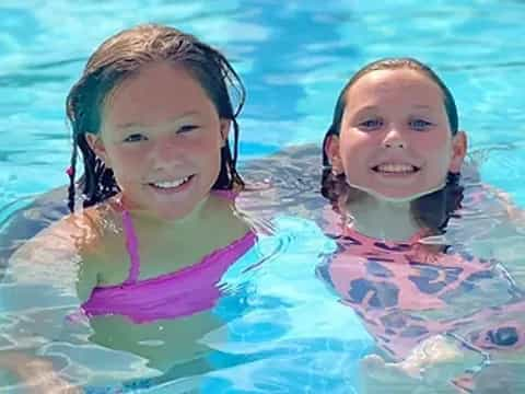 two girls in a pool