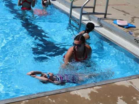 a group of people in a pool