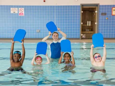 a group of kids in a pool