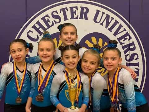 a group of girls wearing medals