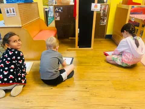 a group of children sitting on the floor