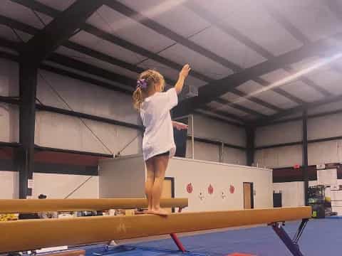 a girl standing on a mat