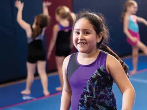 a girl in a purple dress