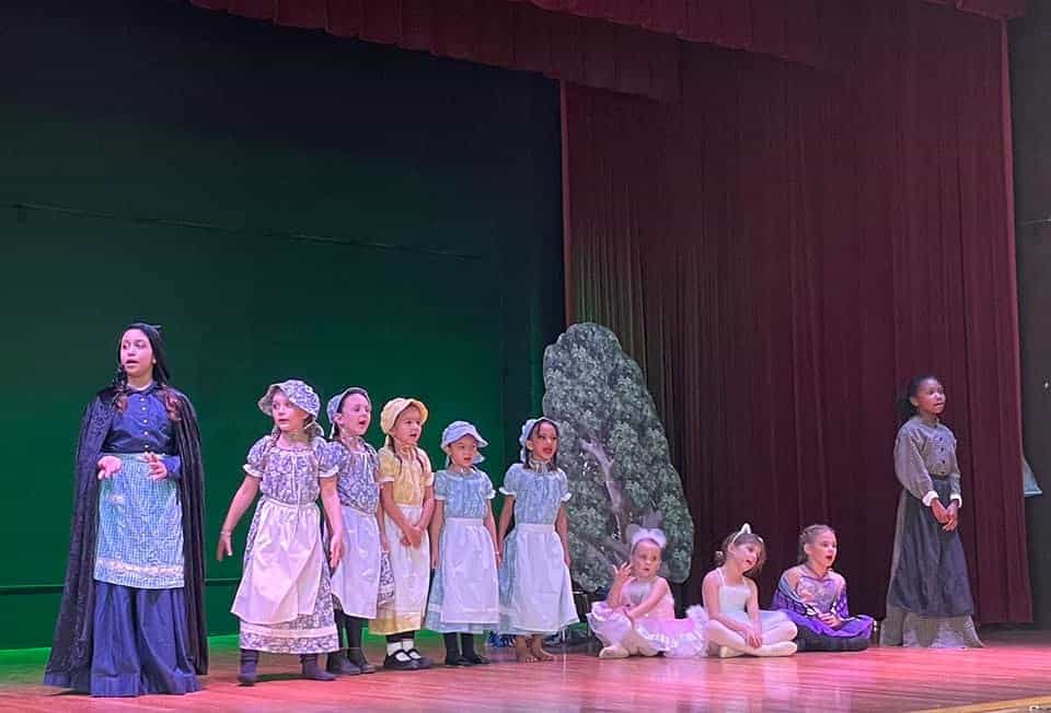 a group of children on a stage